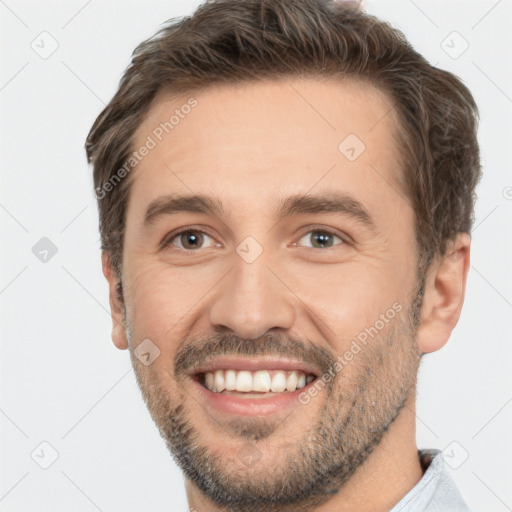 Joyful white adult male with short  brown hair and brown eyes