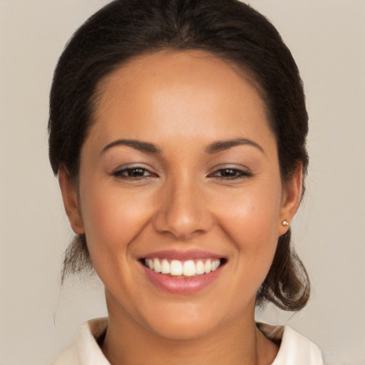 Joyful white young-adult female with medium  brown hair and brown eyes