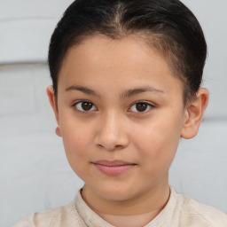 Joyful white child female with short  brown hair and brown eyes