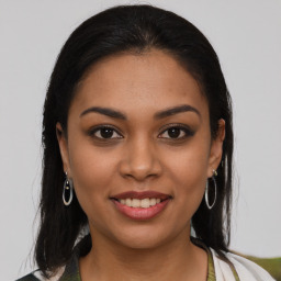 Joyful latino young-adult female with medium  brown hair and brown eyes