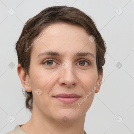 Joyful white young-adult female with short  brown hair and grey eyes