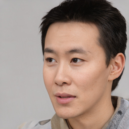 Neutral asian young-adult male with short  black hair and brown eyes