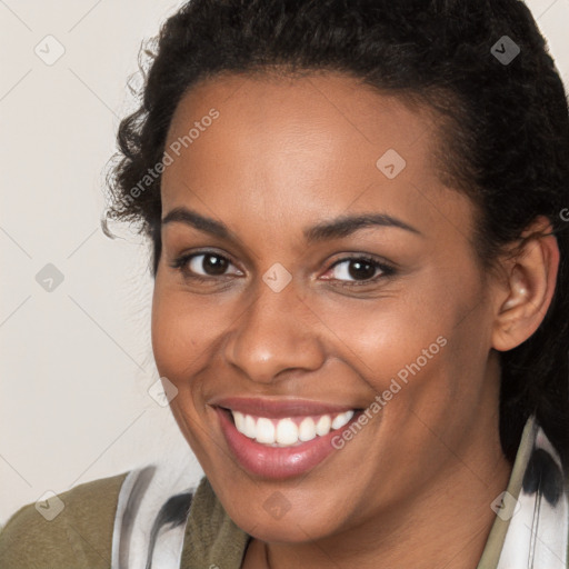 Joyful latino young-adult female with long  brown hair and brown eyes