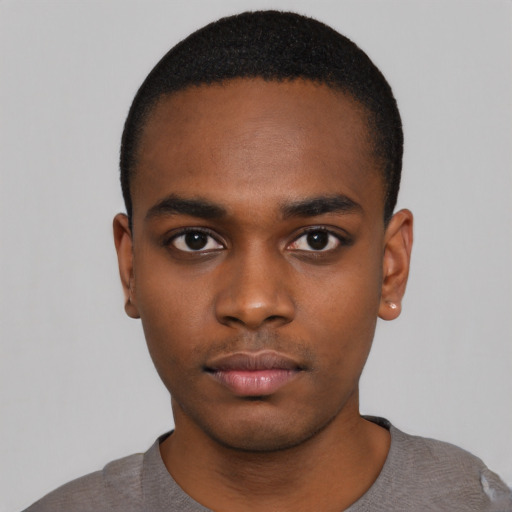 Neutral black young-adult male with short  black hair and brown eyes