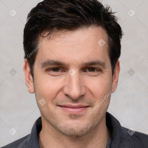 Joyful white adult male with short  brown hair and brown eyes