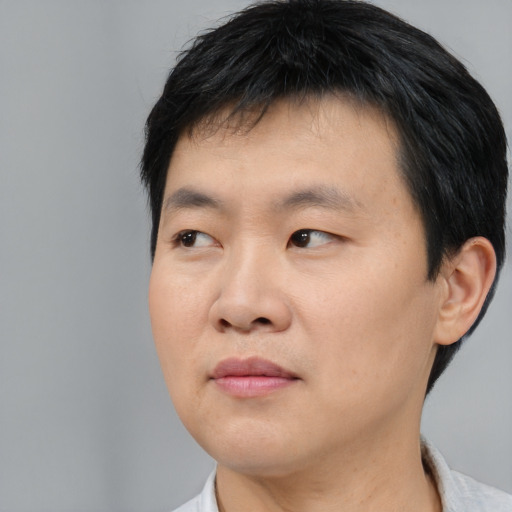 Neutral asian young-adult male with short  black hair and brown eyes