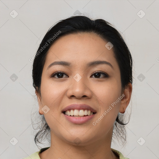 Joyful asian young-adult female with medium  black hair and brown eyes