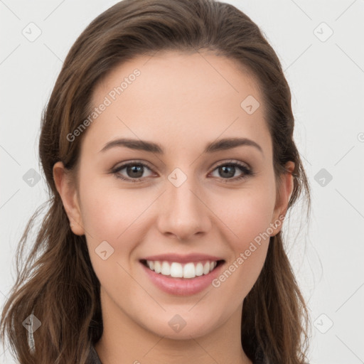 Joyful white young-adult female with long  brown hair and grey eyes