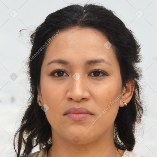 Joyful latino young-adult female with medium  brown hair and brown eyes