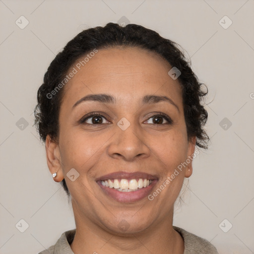 Joyful latino young-adult female with short  brown hair and brown eyes