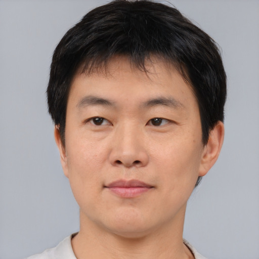 Neutral asian young-adult male with short  black hair and brown eyes
