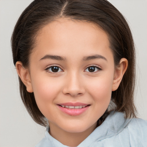 Joyful white child female with medium  brown hair and brown eyes