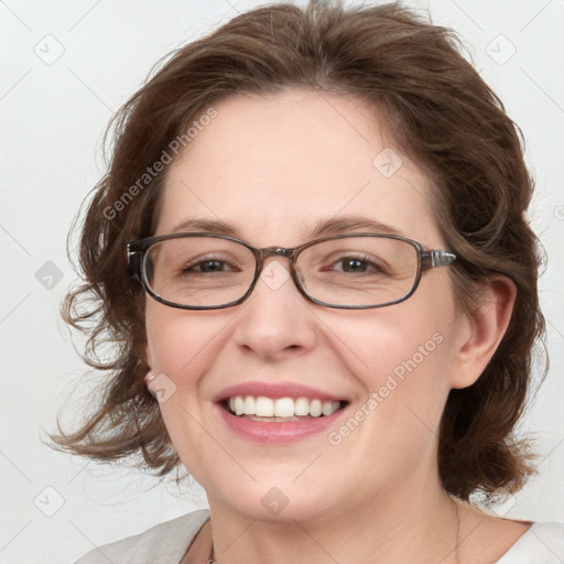 Joyful white adult female with medium  brown hair and blue eyes