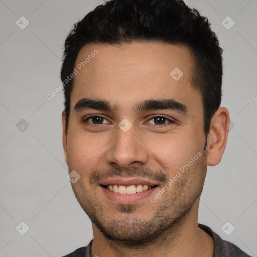 Joyful white young-adult male with short  black hair and brown eyes