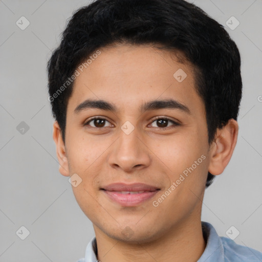 Joyful latino young-adult male with short  black hair and brown eyes