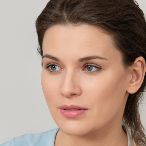 Neutral white young-adult female with medium  brown hair and brown eyes