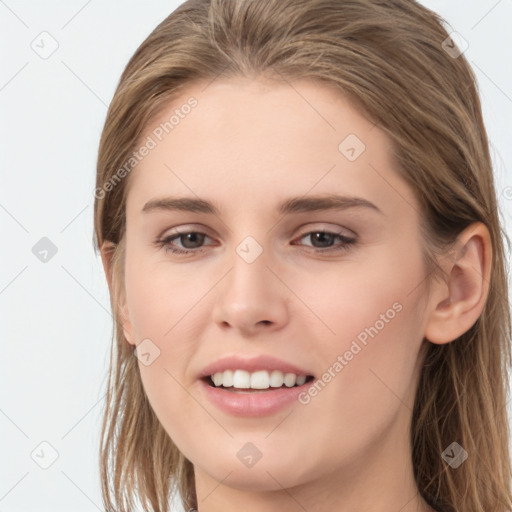 Joyful white young-adult female with long  brown hair and grey eyes