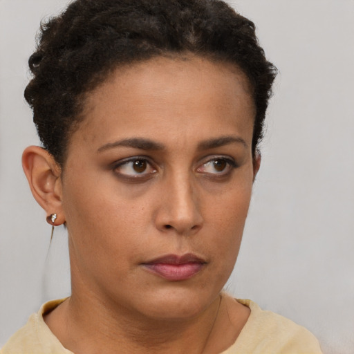 Neutral latino young-adult female with short  brown hair and brown eyes