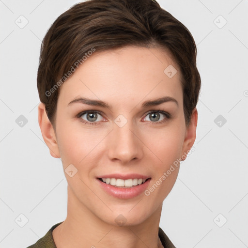 Joyful white young-adult female with short  brown hair and grey eyes