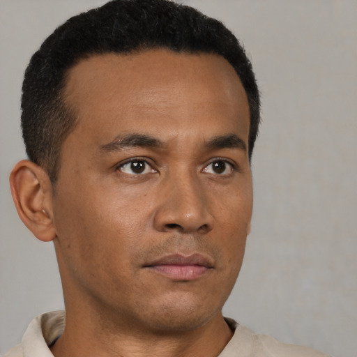 Neutral black young-adult male with short  brown hair and brown eyes