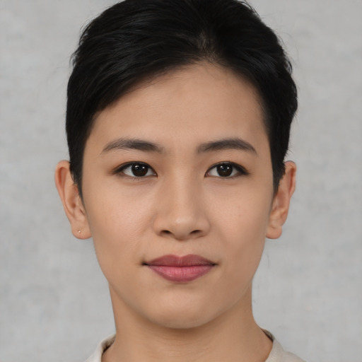 Joyful asian young-adult female with short  black hair and brown eyes