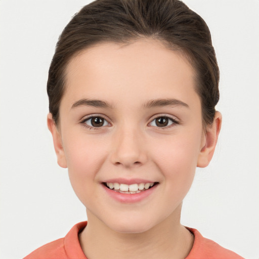 Joyful white child female with short  brown hair and brown eyes