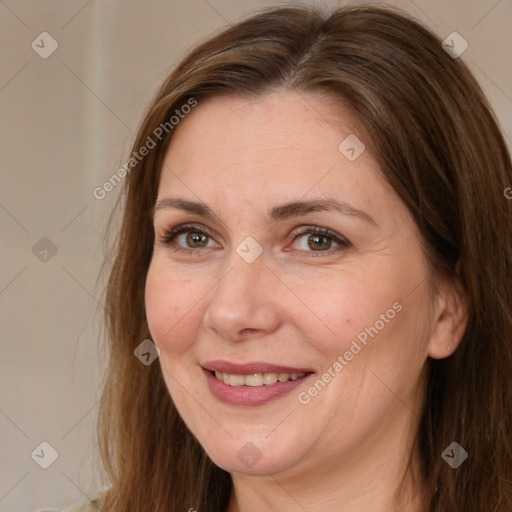 Joyful white adult female with medium  brown hair and brown eyes