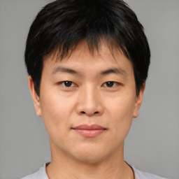 Neutral asian young-adult male with short  brown hair and brown eyes