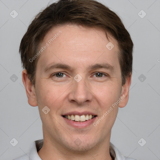 Joyful white adult male with short  brown hair and grey eyes