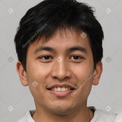 Joyful asian young-adult male with short  brown hair and brown eyes