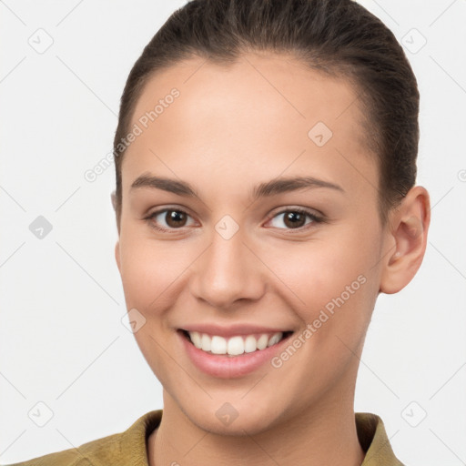 Joyful white young-adult female with short  brown hair and brown eyes