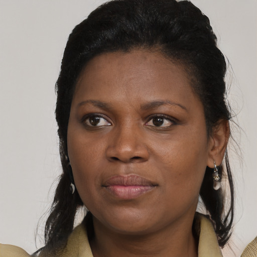 Joyful black young-adult female with medium  brown hair and brown eyes