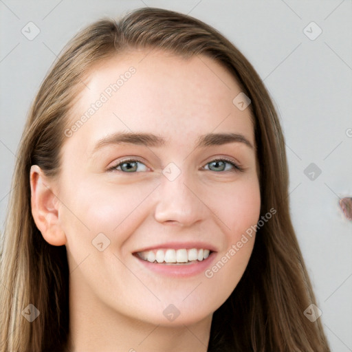 Joyful white young-adult female with long  brown hair and grey eyes