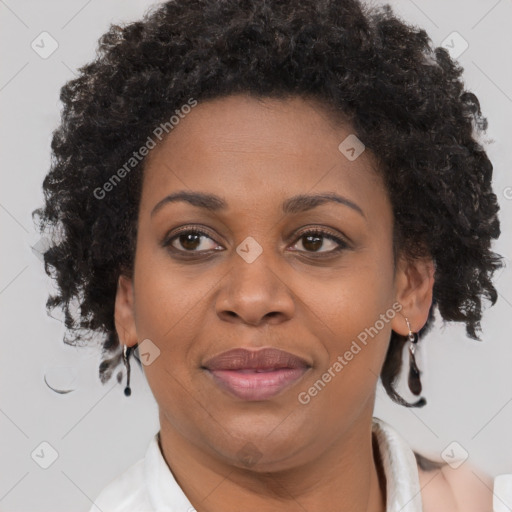 Joyful black adult female with short  brown hair and brown eyes