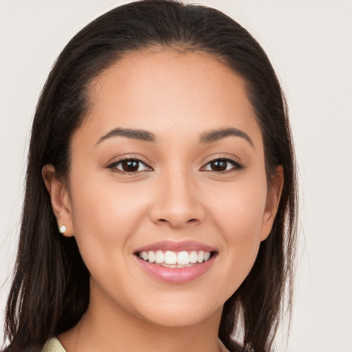 Joyful white young-adult female with long  brown hair and brown eyes