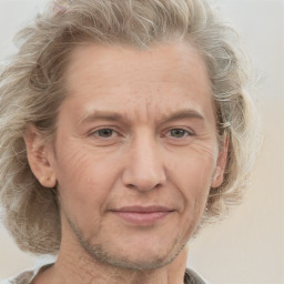 Joyful white adult male with medium  brown hair and grey eyes