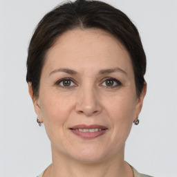 Joyful white adult female with short  brown hair and grey eyes