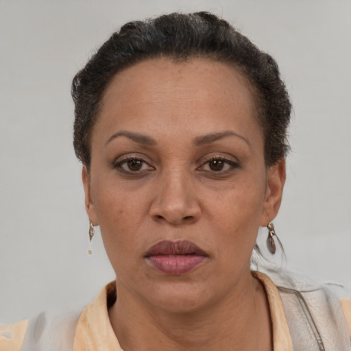 Neutral black adult female with short  brown hair and brown eyes