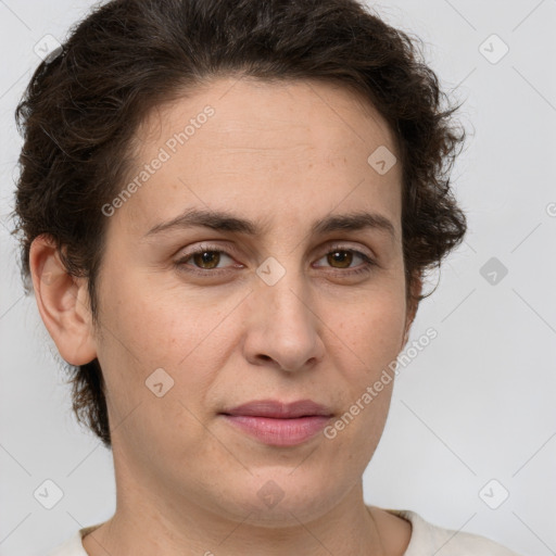 Joyful white adult female with short  brown hair and brown eyes