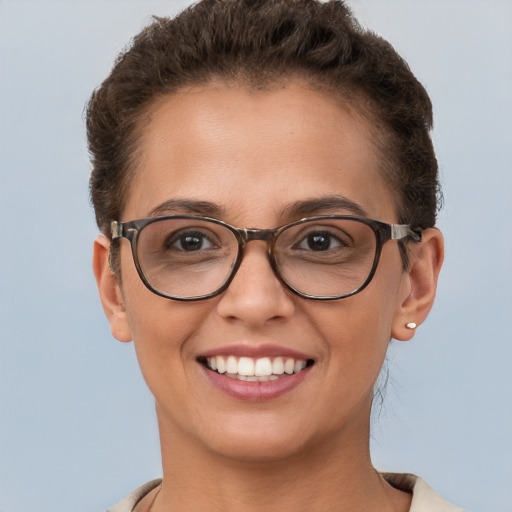 Joyful white young-adult female with short  brown hair and brown eyes