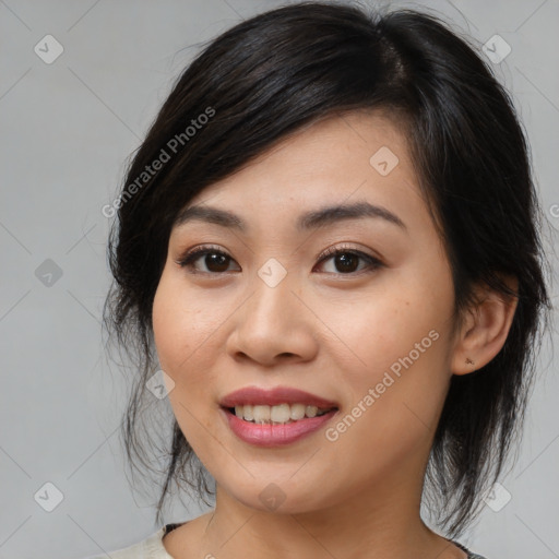 Joyful asian young-adult female with medium  black hair and brown eyes