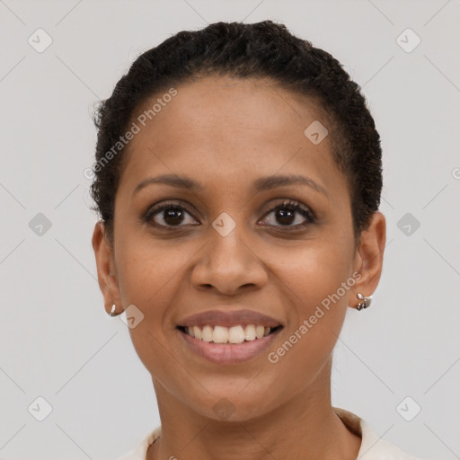 Joyful latino young-adult female with short  brown hair and brown eyes