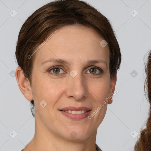 Joyful white adult female with short  brown hair and grey eyes