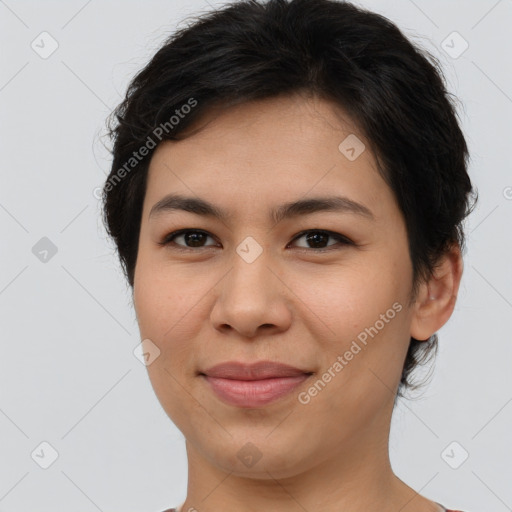 Joyful asian young-adult female with short  brown hair and brown eyes