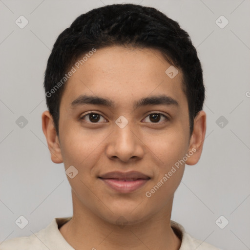 Joyful latino young-adult male with short  black hair and brown eyes