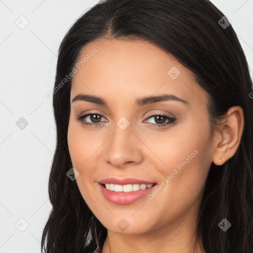 Joyful latino young-adult female with long  brown hair and brown eyes