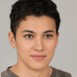 Joyful latino young-adult male with short  brown hair and brown eyes