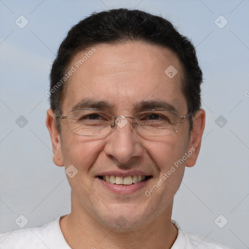 Joyful white adult male with short  brown hair and brown eyes