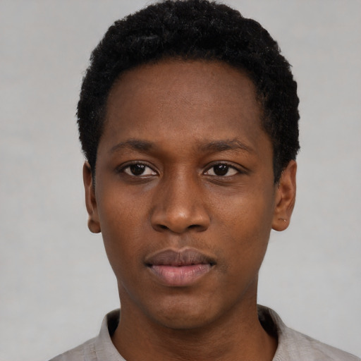 Neutral black young-adult male with short  black hair and brown eyes