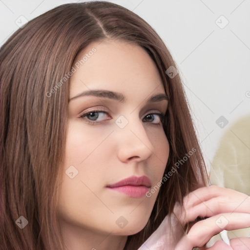 Neutral white young-adult female with long  brown hair and brown eyes